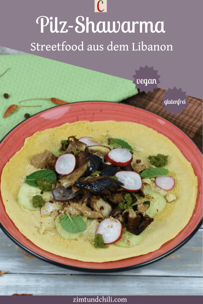 Pilz-Shawarma mit Tortilla auf rotem Teller. Beschrifteter Pin.